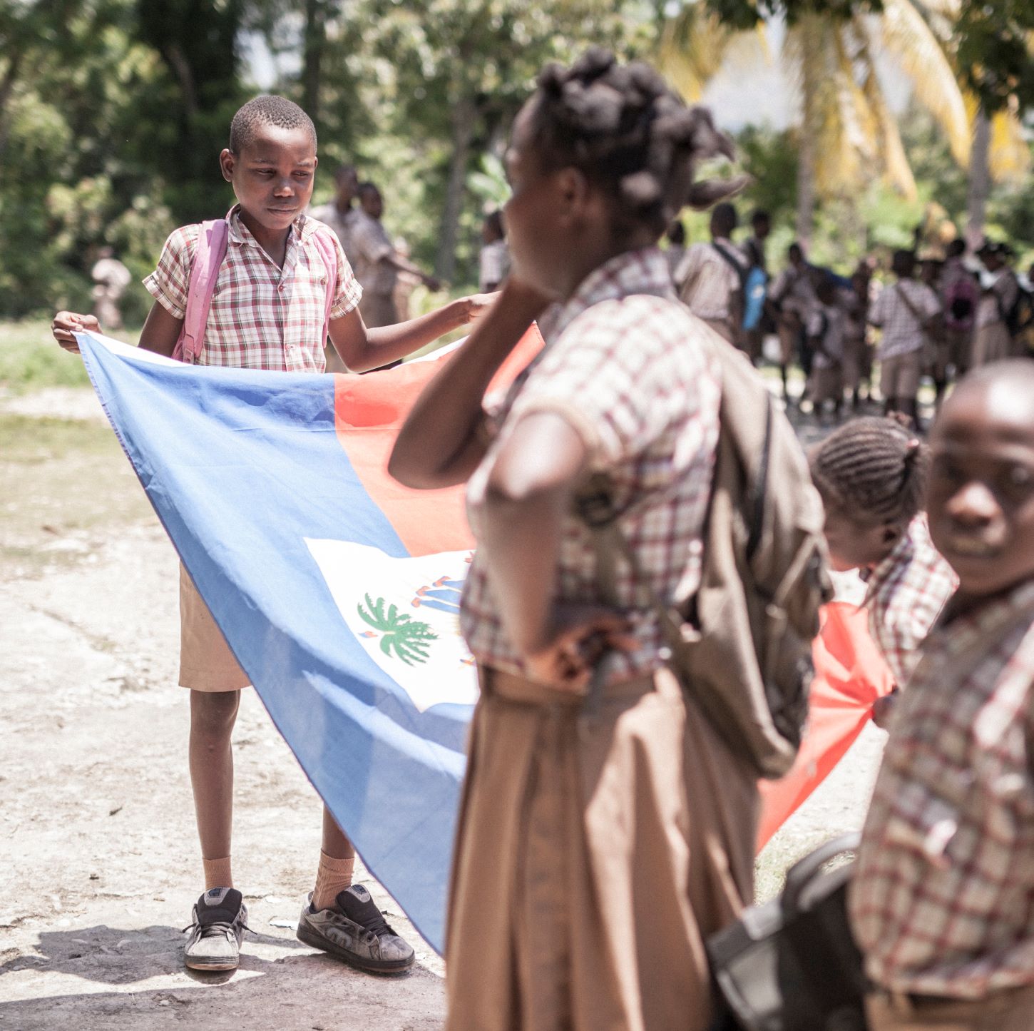 Students in Sarazin (Mirebalais, at one of APA partner schools) during a morning flag raising ceremony. Photo by Anseye Pou Ayiti
